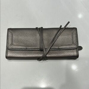 Cole Haan Metallic dark gray Leather travel jewelry bag or clutch.